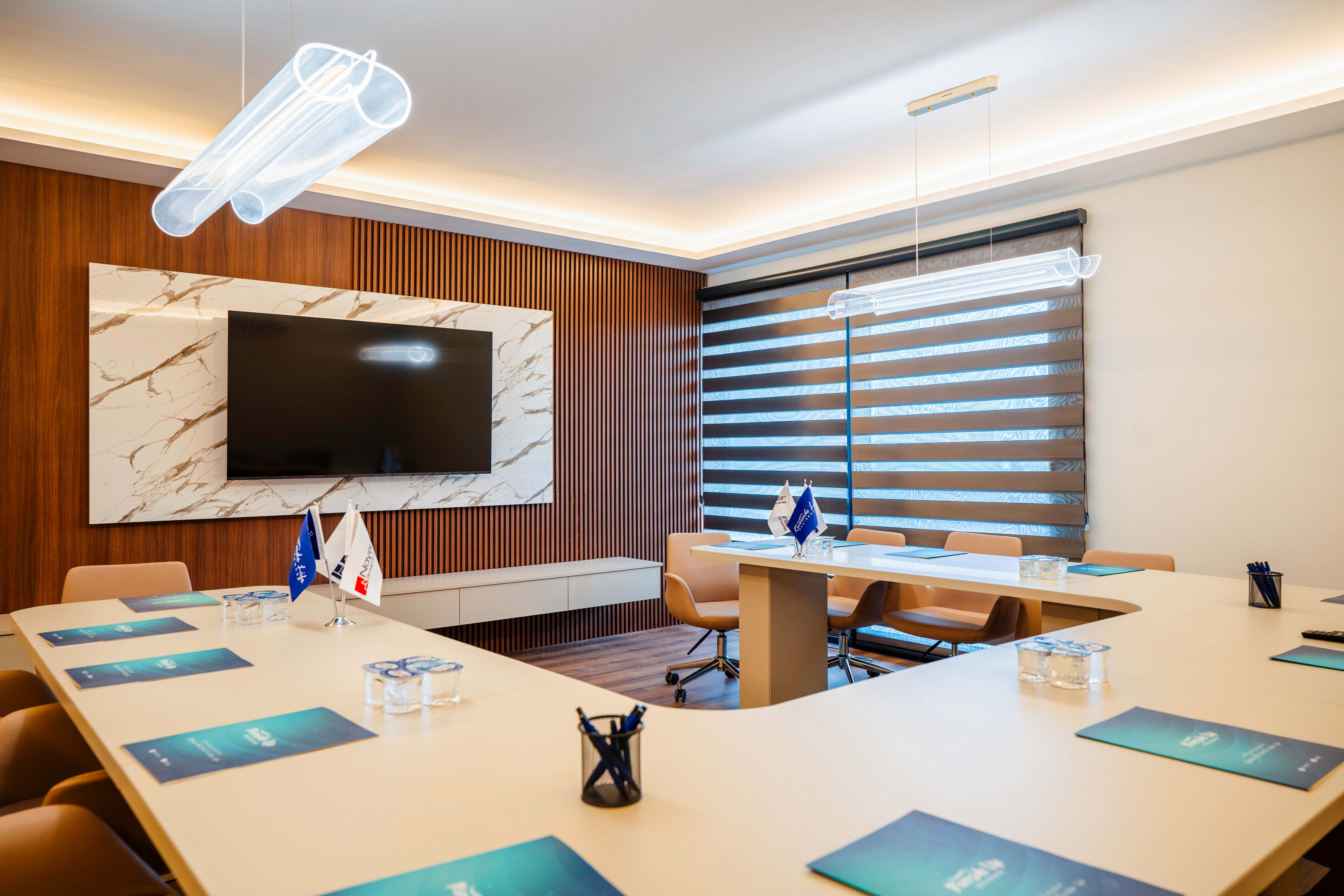 Conference room with wood panel wall and TV