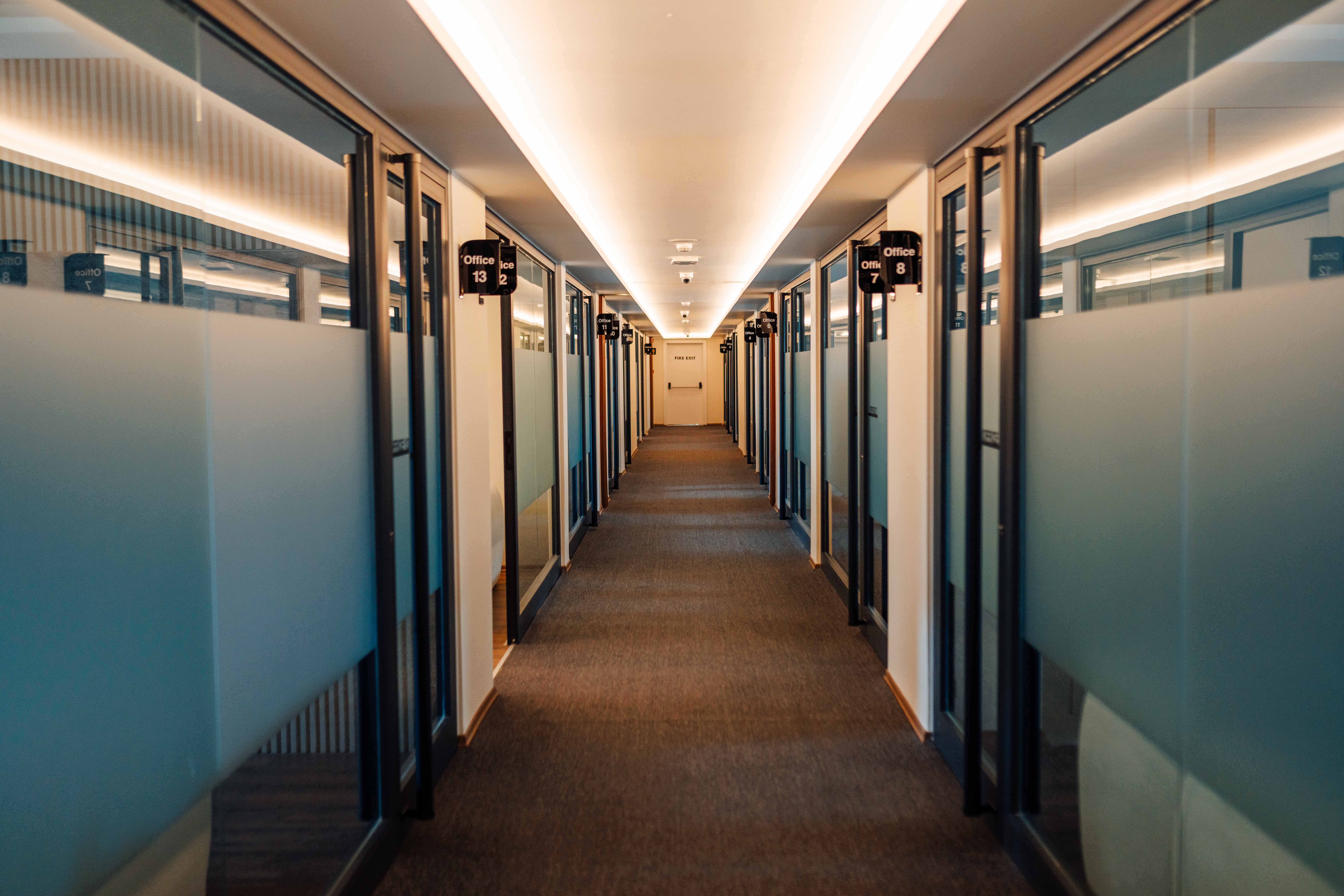 Numbered offices corridor with frosted glass doors